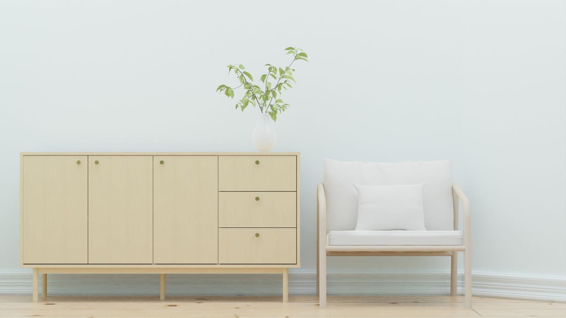 Minimalistyczny salon z drewnianą komodą, fotelem i roślinami